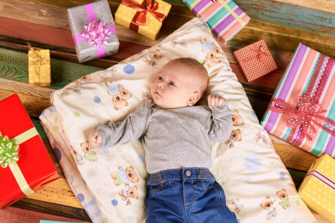Baby Lying Near Presents