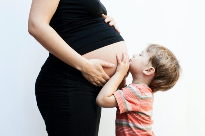 Boy With Pregnant Mother