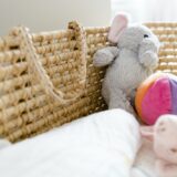 Closeup Of A Baby Basket And Toys