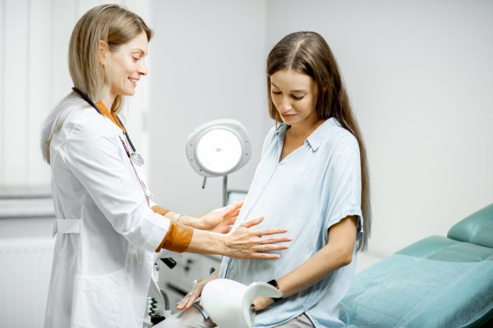 Pregnant Woman With Ginecologist In The Office