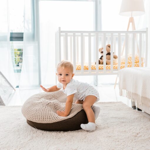 Adorable Toddler In White Nursery Room