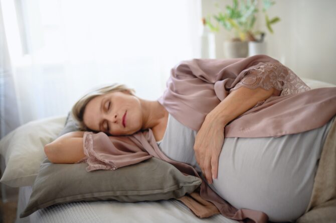 Pregnant Woman Sleeping And Resting In Her Bed.
